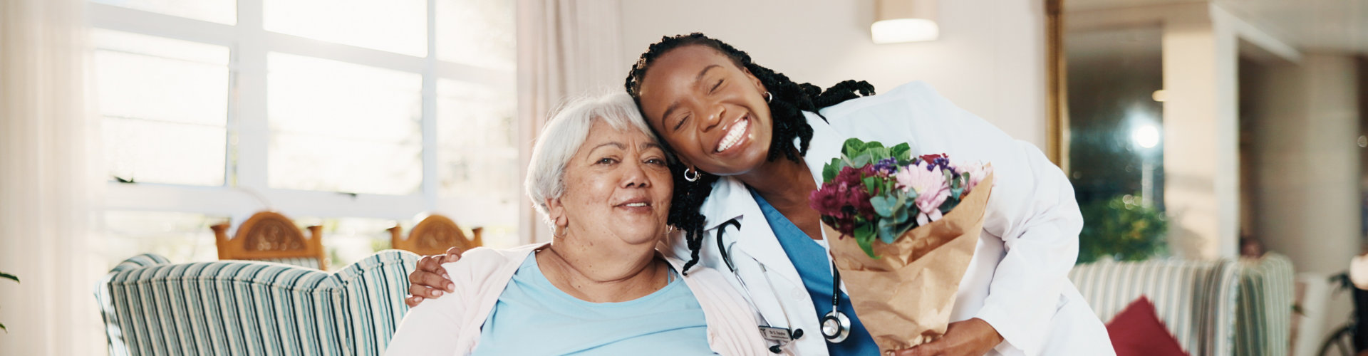 Patient and nurse smiling together